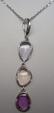 Pendentif et chaine maille forcat en or blanc serti de 3 saphirs non