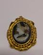 Pendentif en or jaune 18K (750°/00) serti d'un camée onyx nicolo